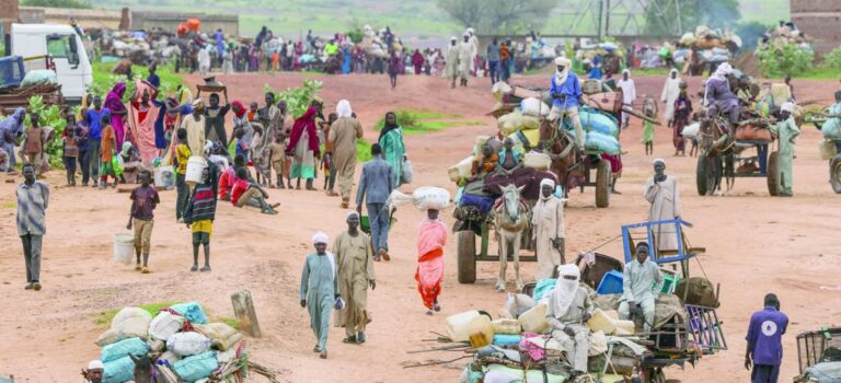 FILE PHOTO: People fleeing the violence in West Darfur